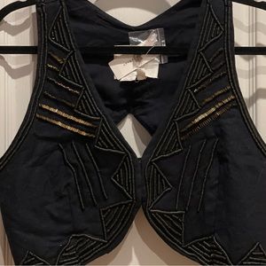 - Anthropology top/vest  three (3) snap/hooks in front.